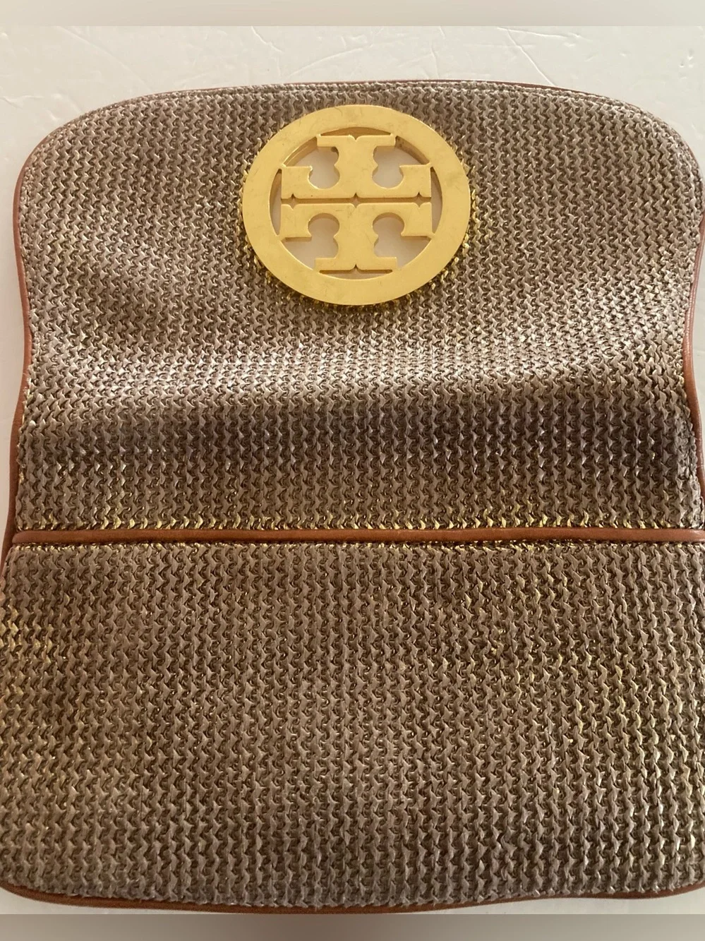 Tory Burch Brown/Gold Woven metallic body,fold over Clutch with big Gold Emblem